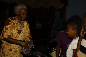 Mrs. Grace a board member handing out kits