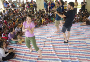 Volunteers play at our Music and Art camp