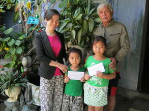 Our students receiving their school tuition fees