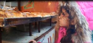 A child buys unhealthy & dirty street food