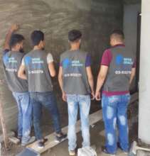 Mfak Braghi team on-site showing off their vests!