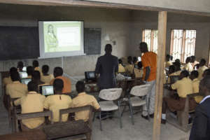 Hands-on computer class in action.