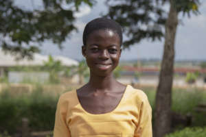 Esther - now a proud secondary school student!
