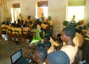 Reading e-books , Takyiman Presby school, Ashanti.
