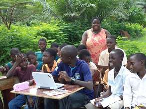 Guided by their librarian, pupils explore the Web.