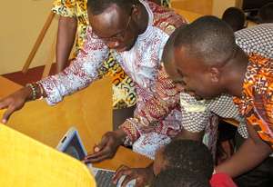 Teachers learn practical computer teaching skills.