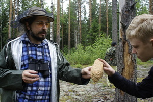 The teacher Mr. Kuvshinskiy shows mushroom