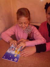 A blind girl Enjoying the Saint Nickolas card
