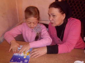 A blind girl Enjoying the Saint Nickolas card 2