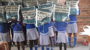Children (ID hidden) pose with their blankets.