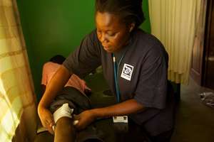 Retrak's nurse caring for an injured street boy