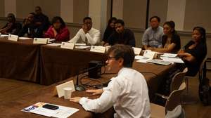 George Stephanopoulos engages students in debate.