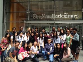Students tour the New York Times news room.
