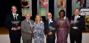 Dr. Chris receiving her Faith in Health Award