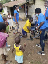 Man Climbing into his New Wheelchair