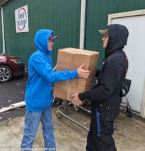 Packing medical supplies at Through These Hands