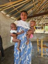 A Liberian mother with her twins babies.