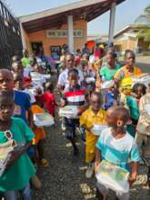 Children receiving food and gifts.