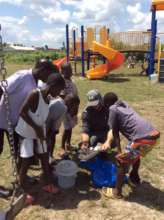 Finishing the fence around the playground