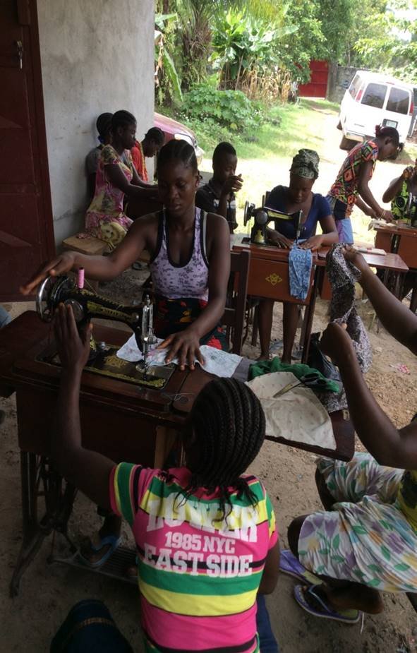Street Girls learning sewing