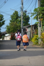 Two foster children on their way to school