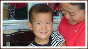 Qiqi and his foster mother