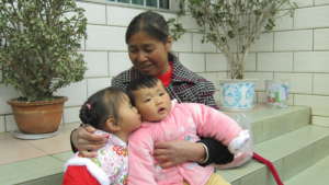 Child and foster family in China