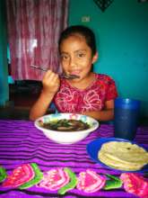 Little girl eating healthy soup