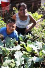Jeffren and his grandmother Angela in their garden