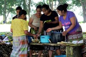 One of 5 Cooking Teams prepares their specialty