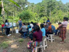 Distributing water filters to community members.