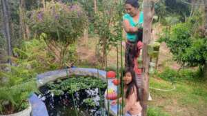 A family surrounding their fish pond (protein)