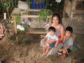 Mom & kids proudly show rabbits raised for protein