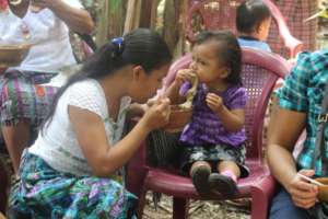 Enjoying nutritious soup at Socorro Demo Center