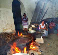Some cooking still occurs over ground-level fires