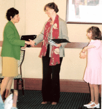 Donna receiving the award from the Mayor's committ