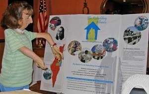 Monica with the Rebuilding Campaign chart