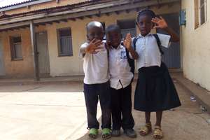 Primary children waving hello to new visitors!