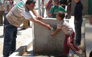 Child washing hands in Zaatari refugee camp