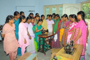 Adolescent girls are being taught sewing on machin