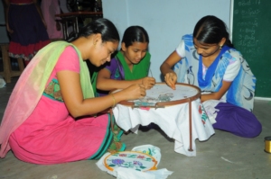 Adolescent girls are practicing  maggam work