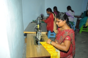 Dress is being stitched by trainees