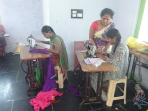 Girls are practicing sewing of cloths