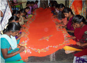 Girls learning painting the Sarees