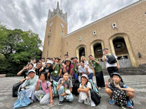 In front of the clock tower at Waseda University.
