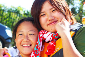 Smiles at dragon boat exercise at Lake Inawashiro