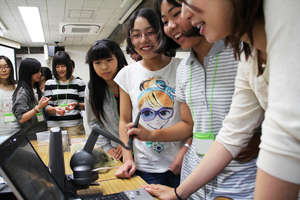 Participants trying out simulated operation