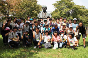 Gathering at the statue of the univ. founder