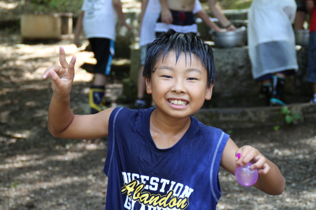 A boy in a water game