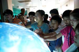 Children touching the tangible Earth